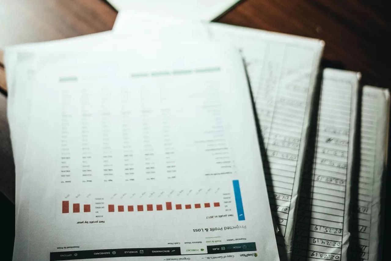 Printed reports and shipping documents on a desk