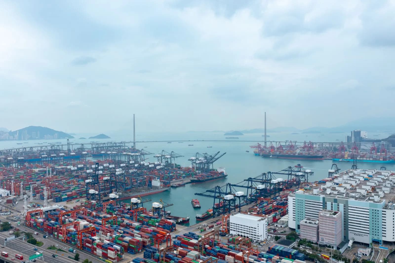 Aerial view of a container terminal with cranes and ships