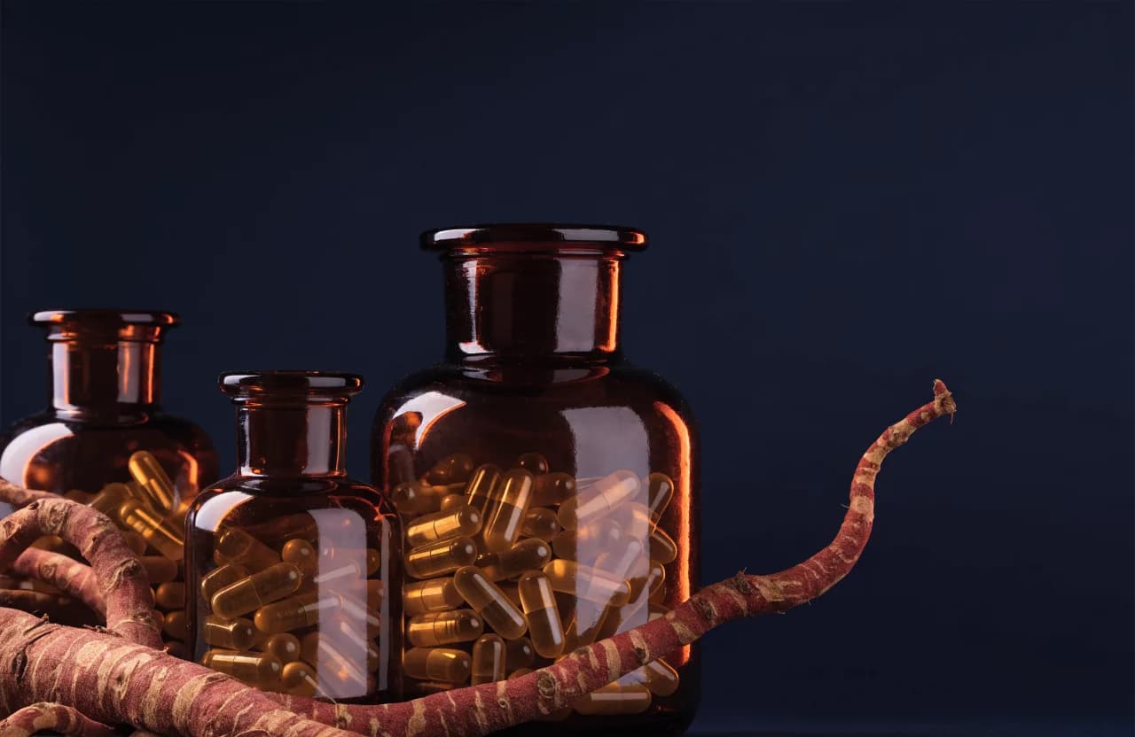 Korean red ginseng roots and supplement jars